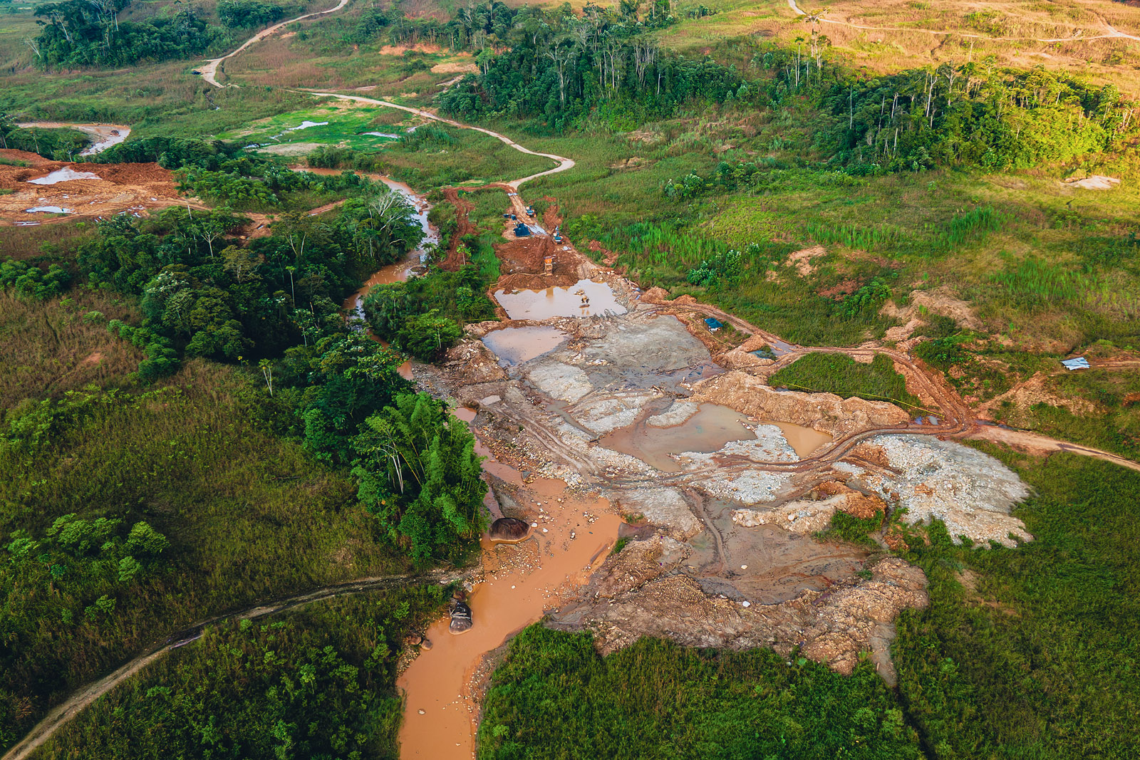 Aerial image showing an illegal gold mine along the Chumbiyacu stream