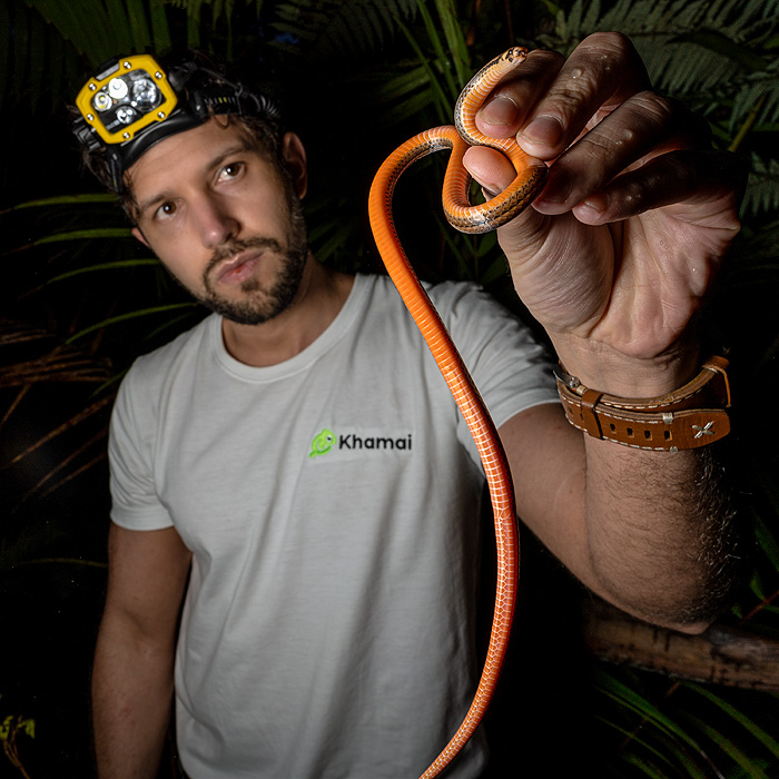Image showing biologist Alejandro Arteaga holding a centipede snake