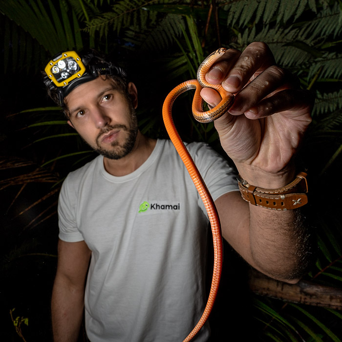 Biologist Alejandro Arteaga holding a centipede snake
